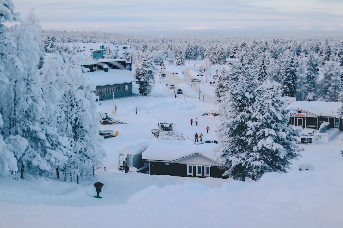 Snowy Finnish village with houses near mountains