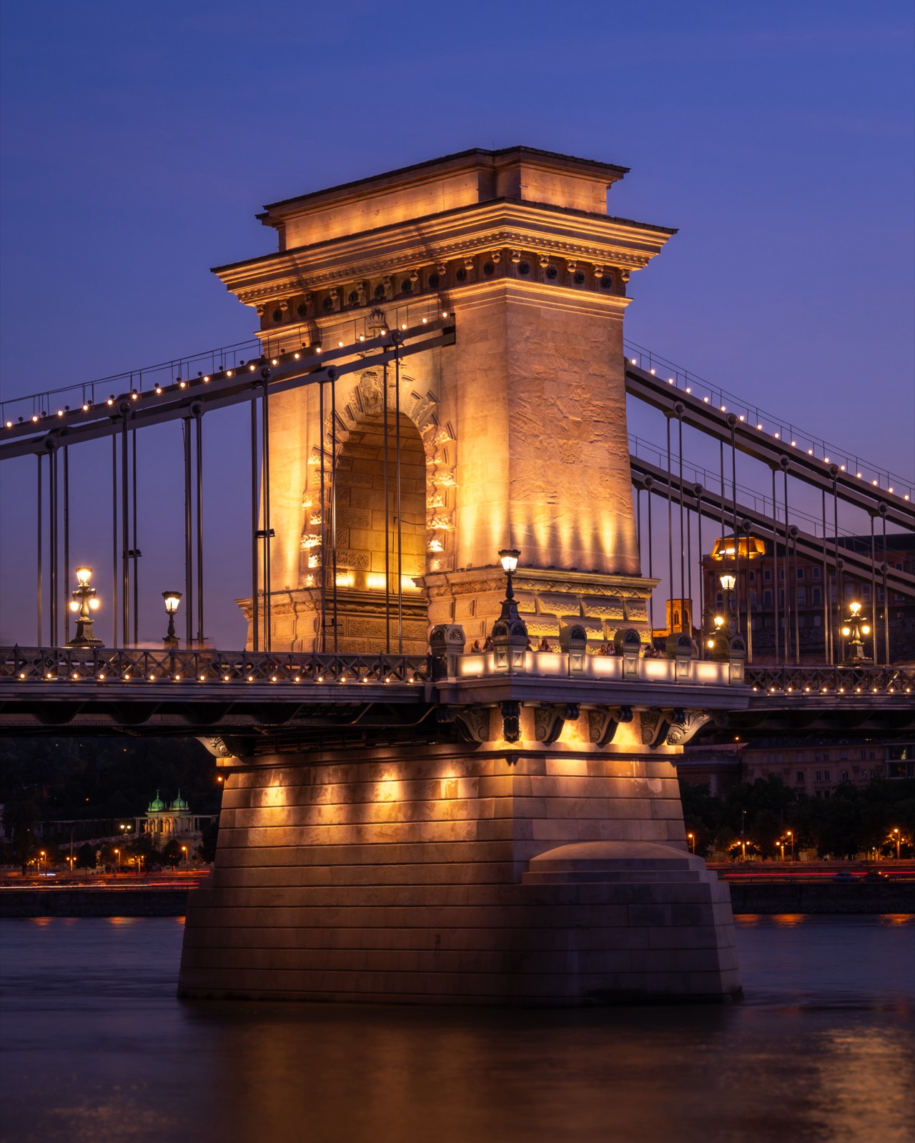 The Széchenyi Chain Bridge lit up at dusk in Budapest