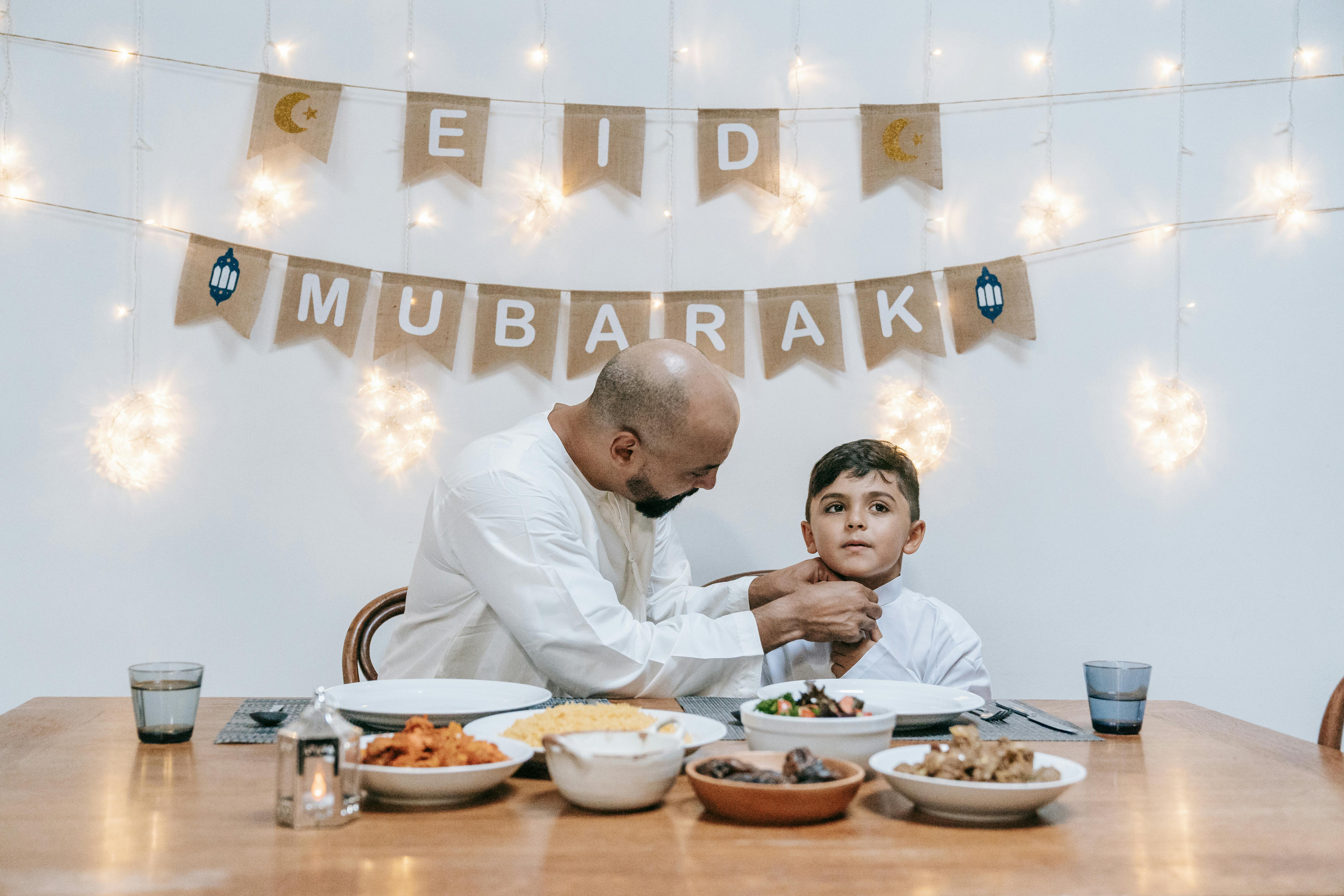 Family gathered at Eid dinner table