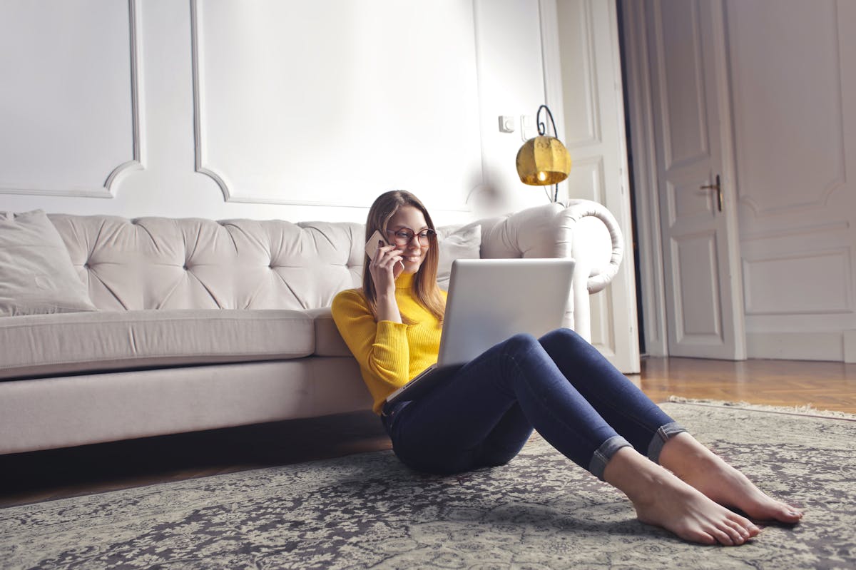 Woman checking information on laptop at home