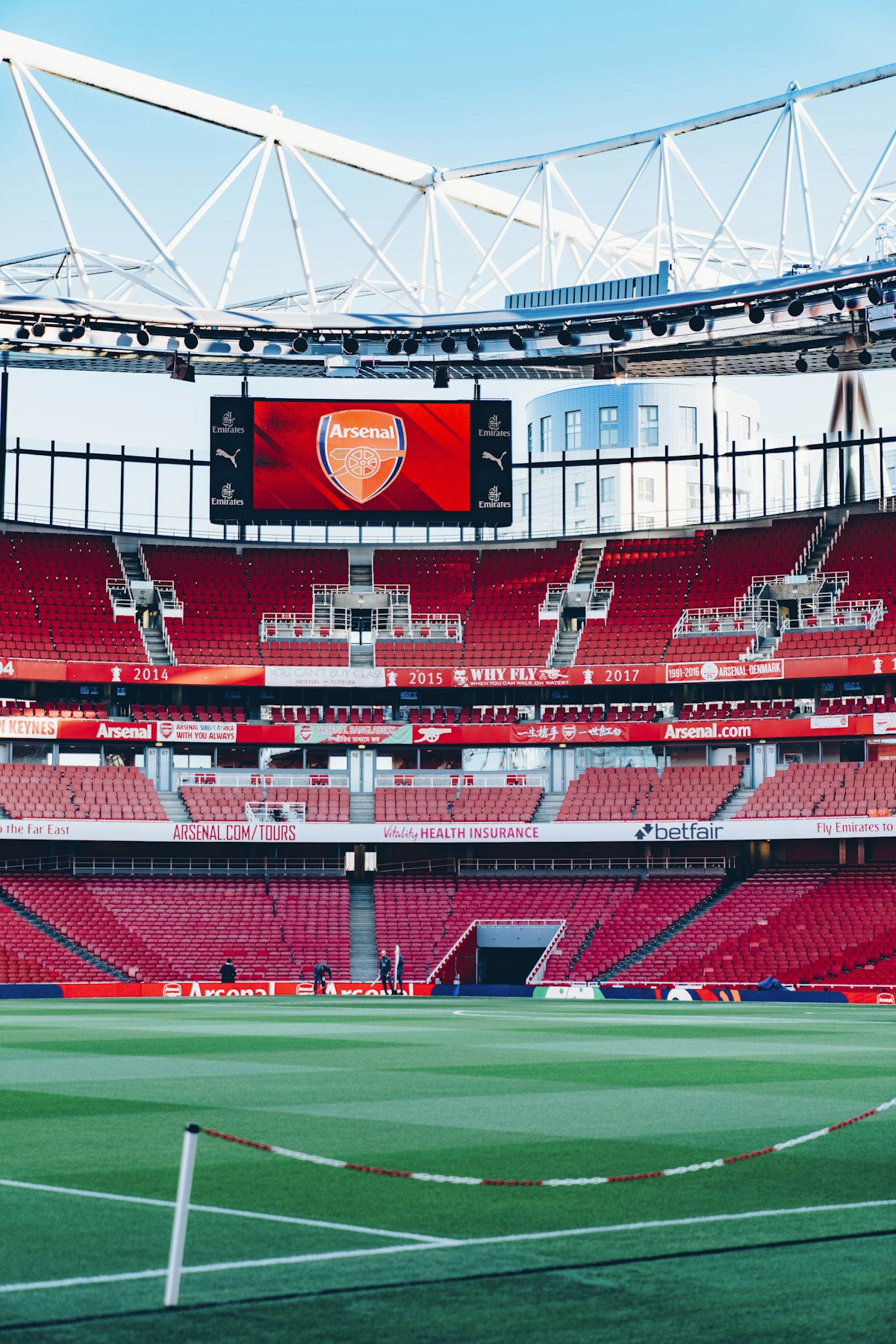 Emirates Stadium, Arsenal's home since 2006 — but the club's name and "Gunners" nickname trace back to 1886, when workers at the Royal Arsenal munitions factory in Woolwich kicked a ball around after their shifts