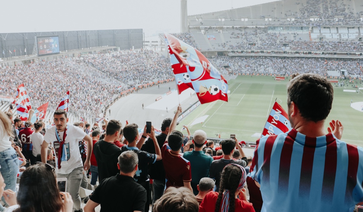Fans celebrating in a packed stadium