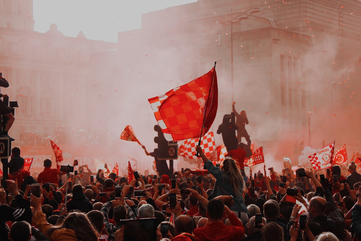 Fans waving flags in a football stadium