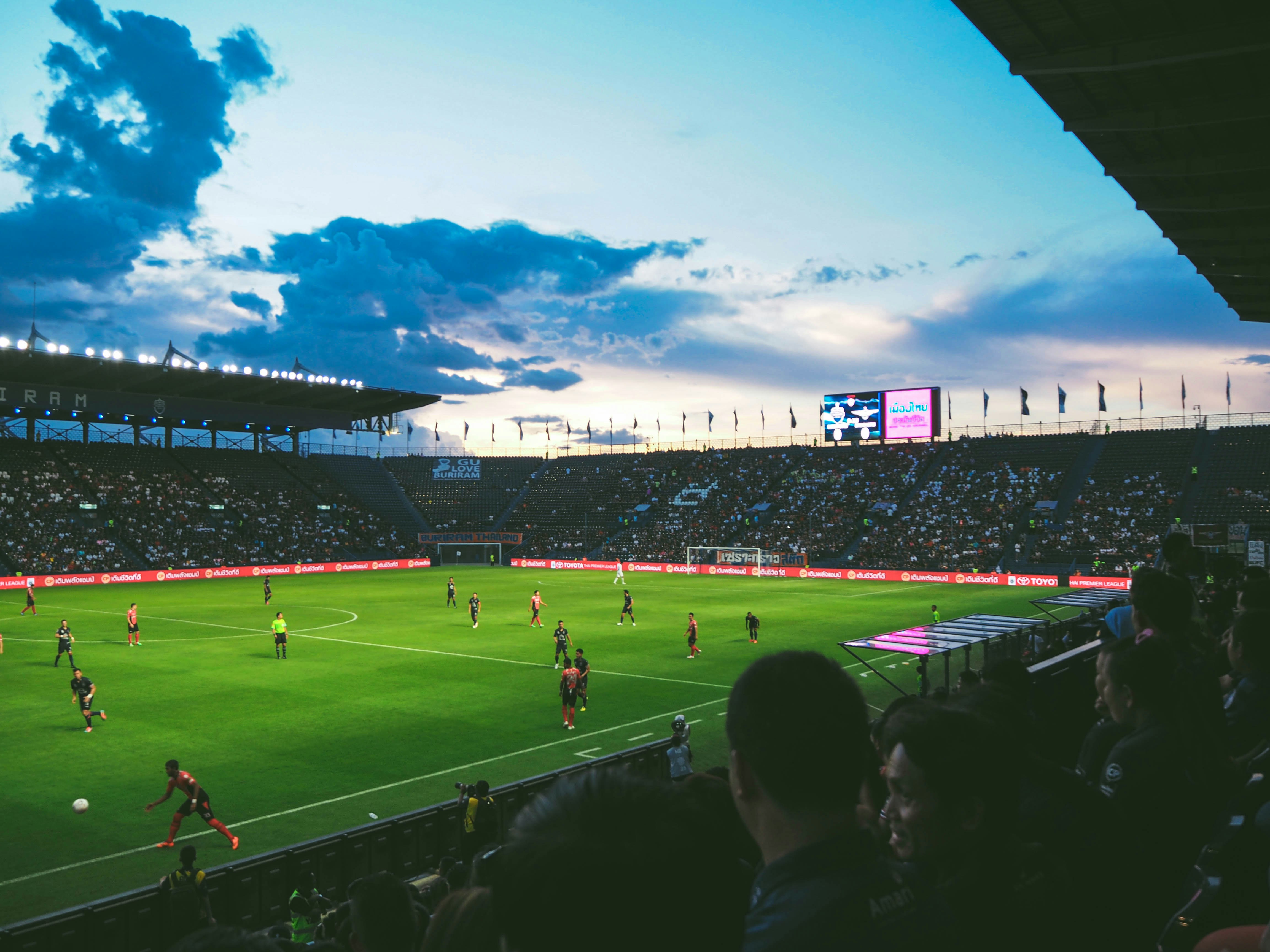 A packed stadium crowd watching a football match