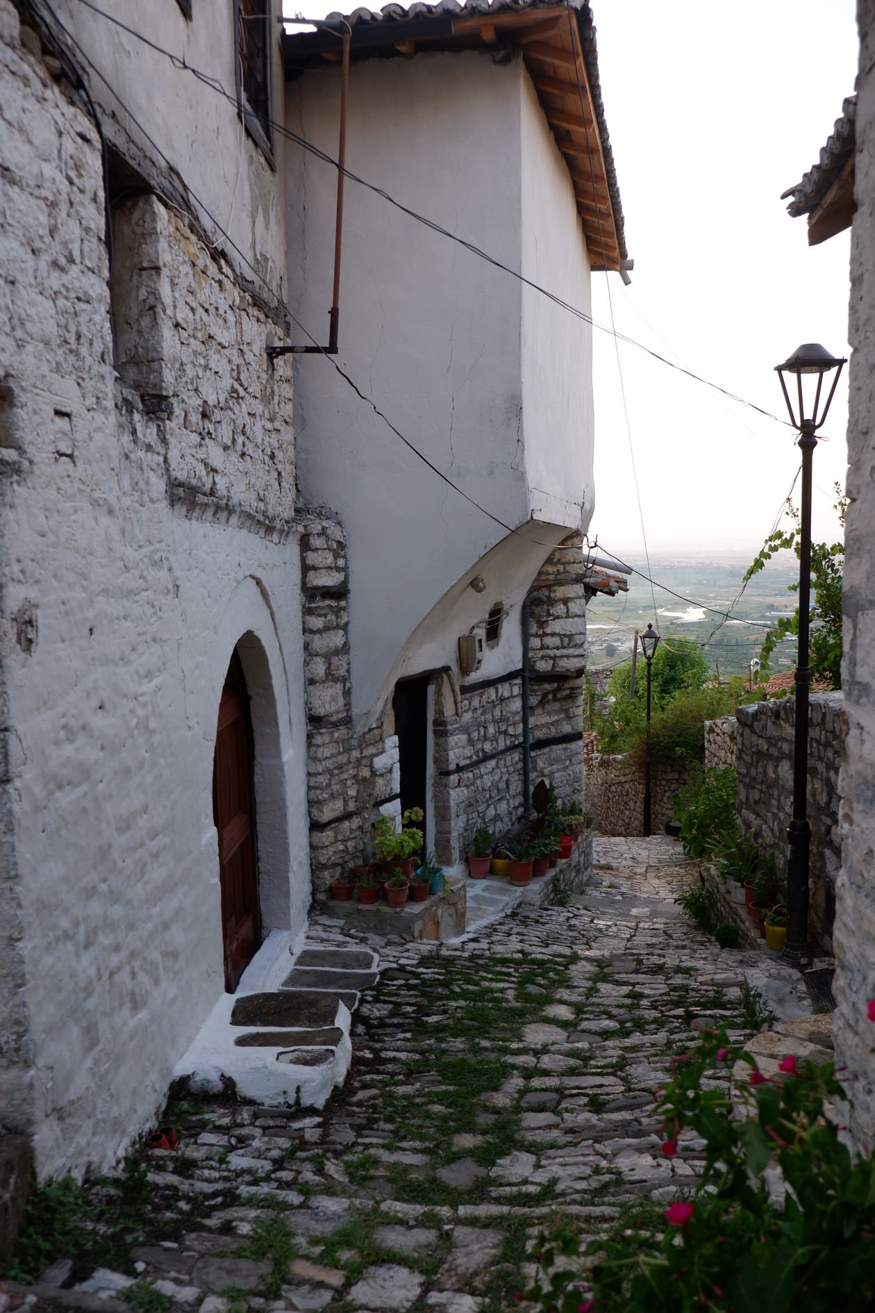 A stone alleyway in the old town of Berat, whose layered Byzantine and Ottoman past mirrors the layers in the Albanian language