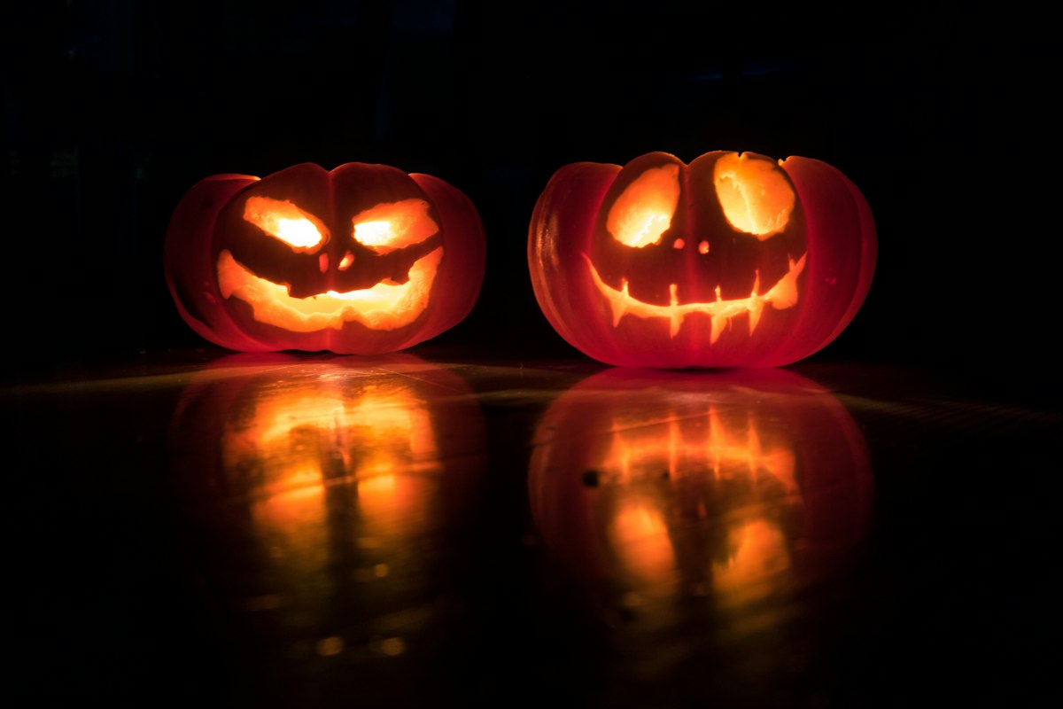 Carved jack-o'-lantern glowing at night
