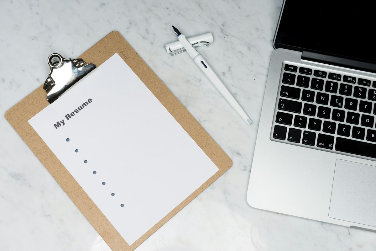 Checklist and pen on a desk during document review — Photo on Unsplash
