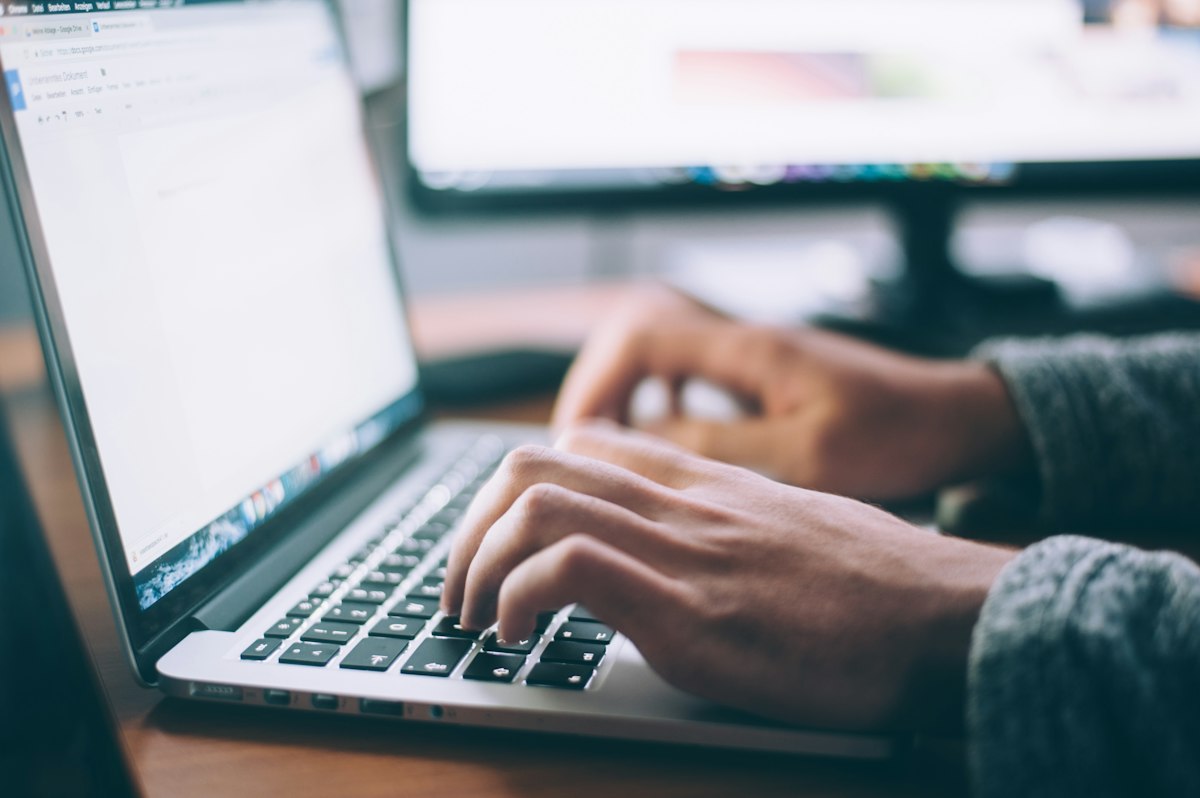 Laptop open for editing a document — Photo on Unsplash